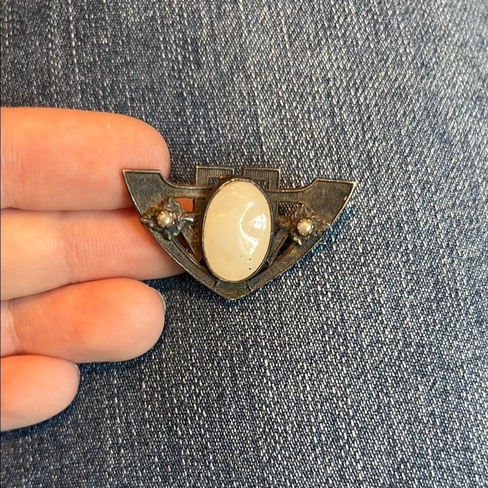 Antique pin, little leaf design with white stones.